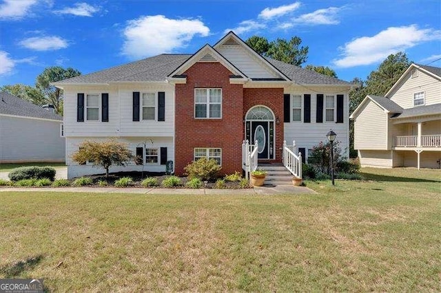 split foyer home with a front yard