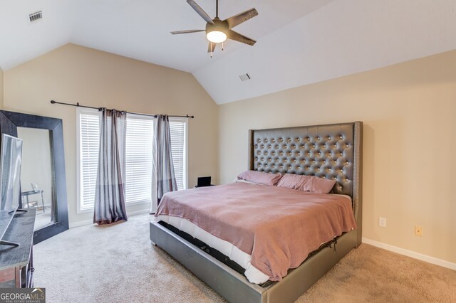 bedroom with ceiling fan, light colored carpet, and lofted ceiling