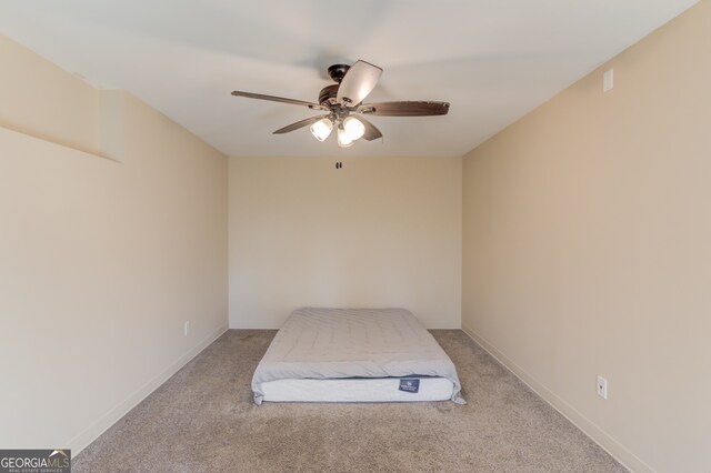 unfurnished bedroom with ceiling fan and light carpet