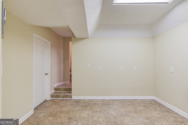 spare room with a textured ceiling