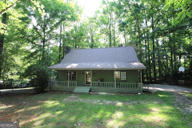 view of front of home featuring a front yard and a porch