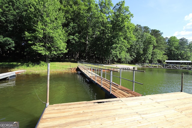 view of dock with a water view