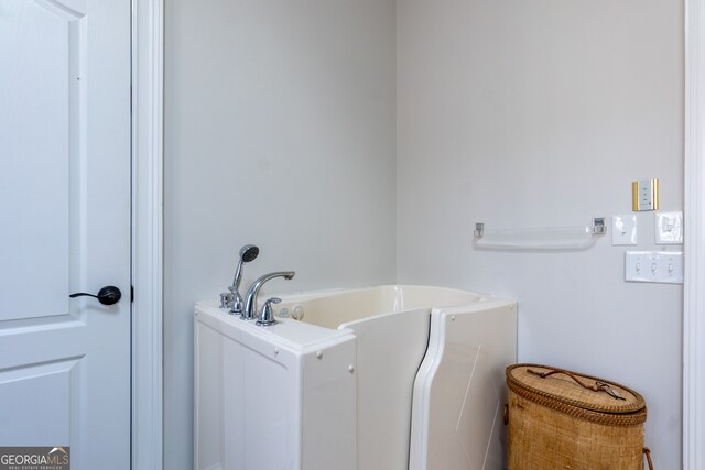 bathroom featuring a tub to relax in