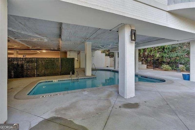 indoor pool with a patio area