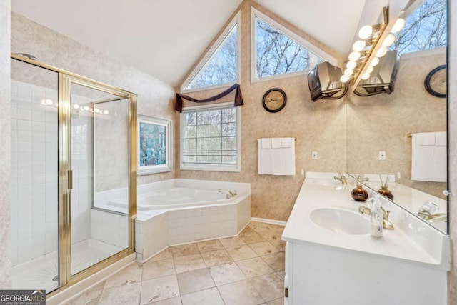 bathroom featuring vanity, separate shower and tub, and lofted ceiling