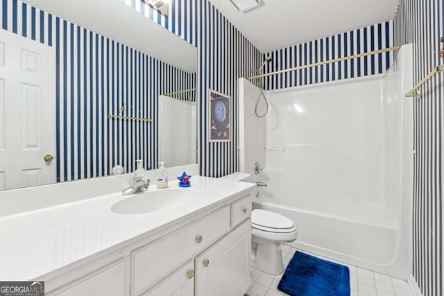 full bathroom featuring tile patterned floors, vanity, shower / bathtub combination, and toilet