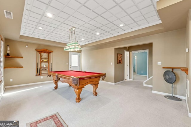 game room featuring a tray ceiling, light carpet, and pool table