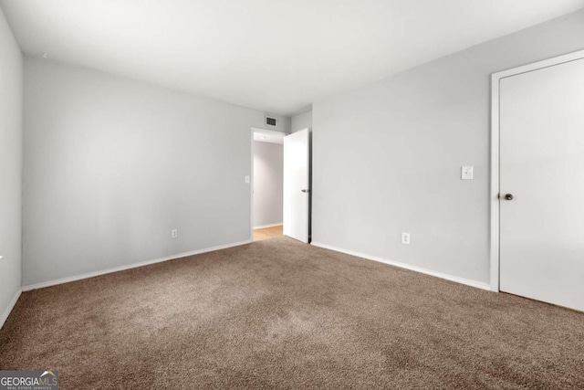 empty room featuring carpet floors