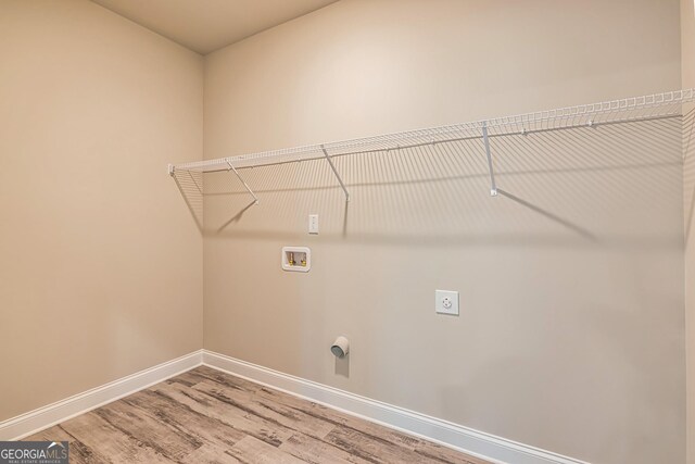 unfurnished living room featuring ceiling fan and light hardwood / wood-style floors