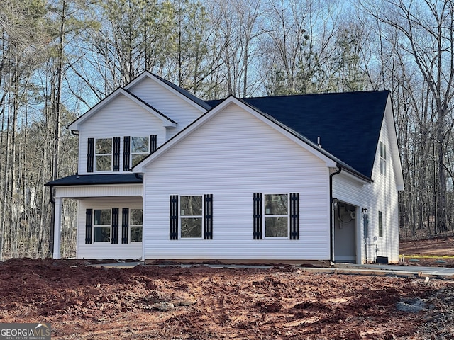 view of side of property featuring a porch