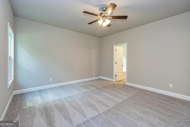 kitchen with sink, light hardwood / wood-style flooring, ceiling fan, stainless steel appliances, and a center island