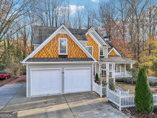 view of front facade featuring covered porch and a garage