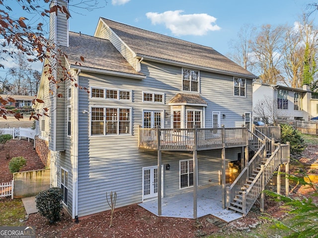 rear view of property featuring a patio and french doors