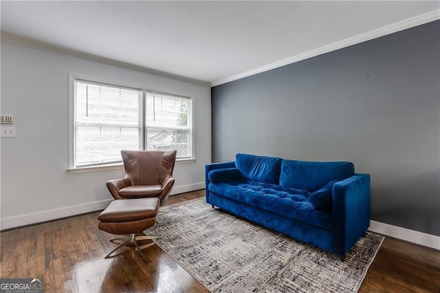 living room featuring dark hardwood / wood-style flooring and crown molding