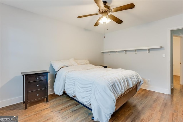 bedroom featuring ceiling fan and wood-type flooring