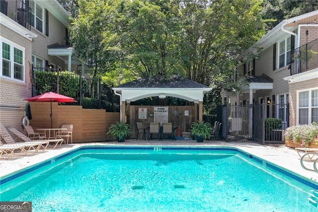 view of swimming pool featuring a gazebo