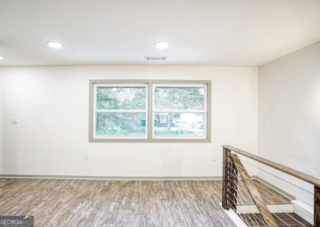 empty room featuring wood-type flooring