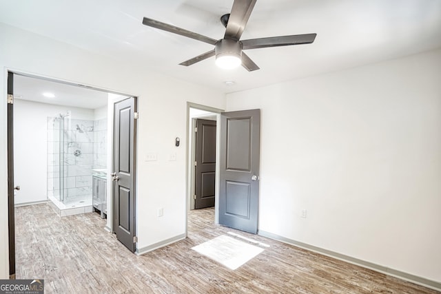 unfurnished bedroom featuring ceiling fan and light hardwood / wood-style floors