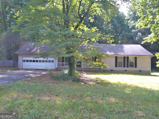 single story home featuring a front lawn, covered porch, and a garage