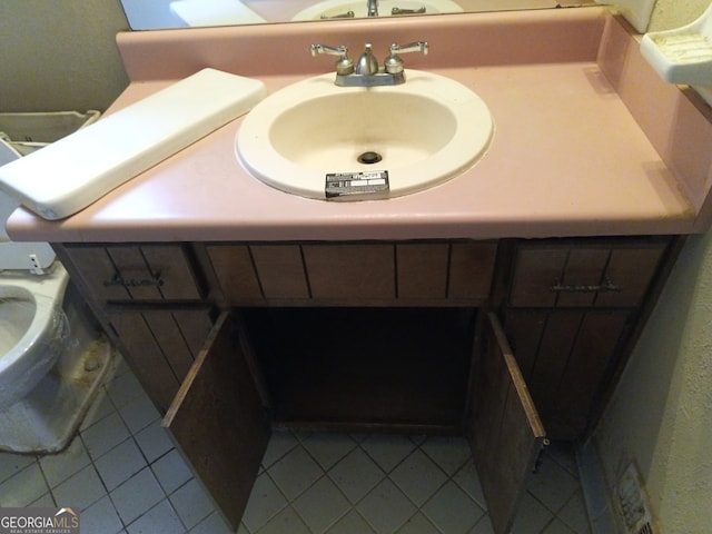 bathroom featuring tile patterned floors and sink