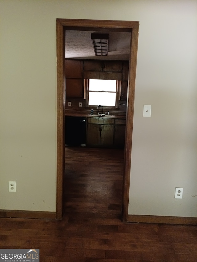 hall with sink and dark hardwood / wood-style floors