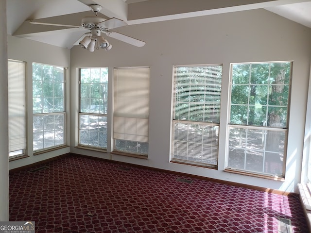 unfurnished sunroom with ceiling fan and lofted ceiling