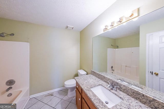 full bathroom with vanity, washtub / shower combination, tile patterned flooring, toilet, and a textured ceiling