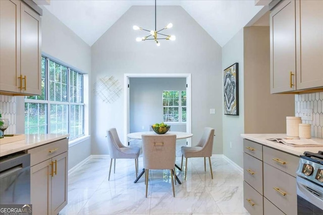 dining room with vaulted ceiling and an inviting chandelier