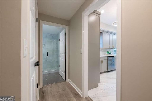 hallway with light wood-type flooring