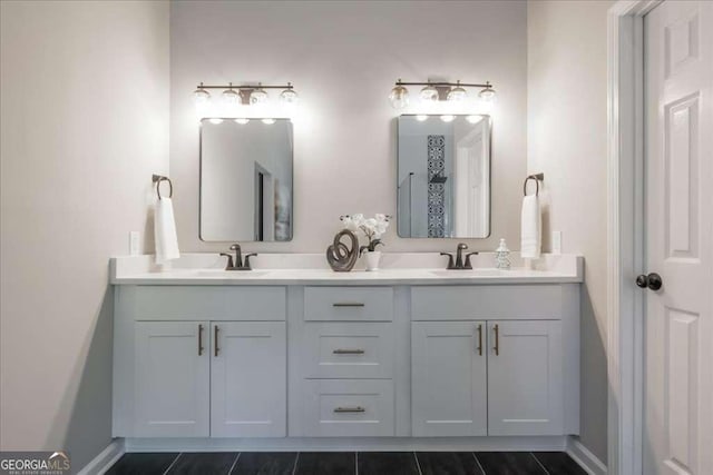 bathroom with tile patterned flooring and vanity