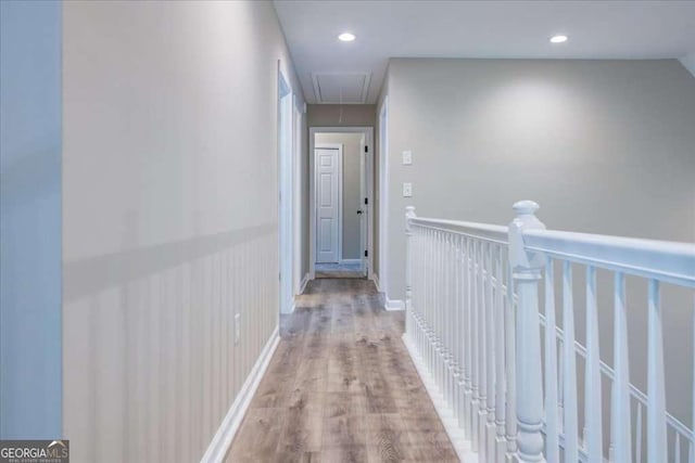 hallway with light hardwood / wood-style flooring