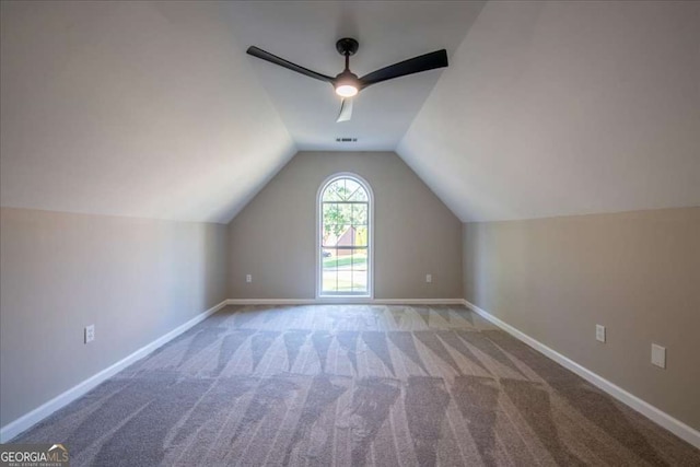 bonus room featuring ceiling fan, carpet floors, and vaulted ceiling