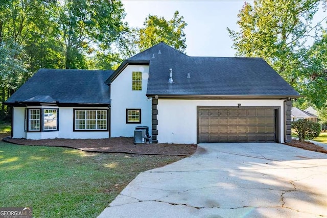 exterior space featuring a garage and central AC