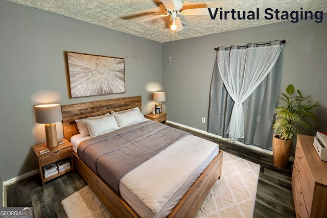 bedroom with ceiling fan, dark wood-type flooring, and a textured ceiling