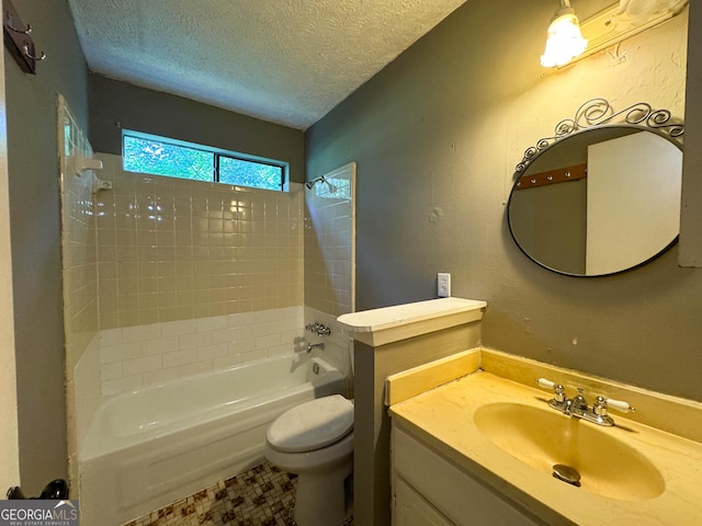 full bathroom with shower / tub combination, vanity, a textured ceiling, and toilet