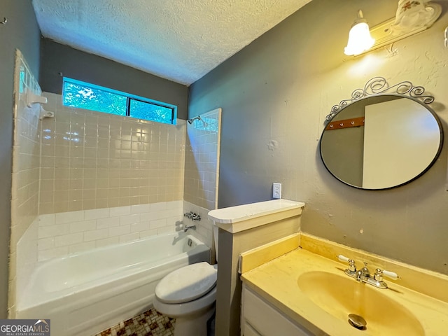 full bathroom featuring vanity, toilet, shower / bath combination, and a textured ceiling