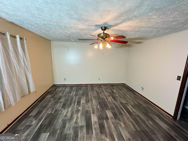 spare room with ceiling fan, dark hardwood / wood-style flooring, and a textured ceiling