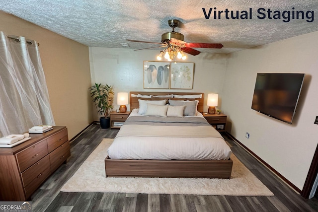 bedroom featuring a textured ceiling, ceiling fan, and dark wood-type flooring