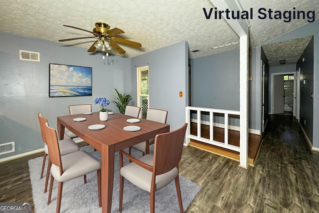 dining area with ceiling fan, dark wood-type flooring, and a textured ceiling