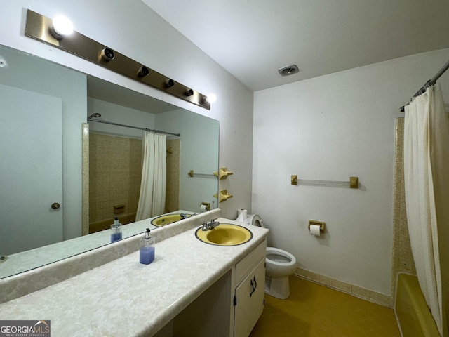 full bathroom with vanity, toilet, and shower / tub combo