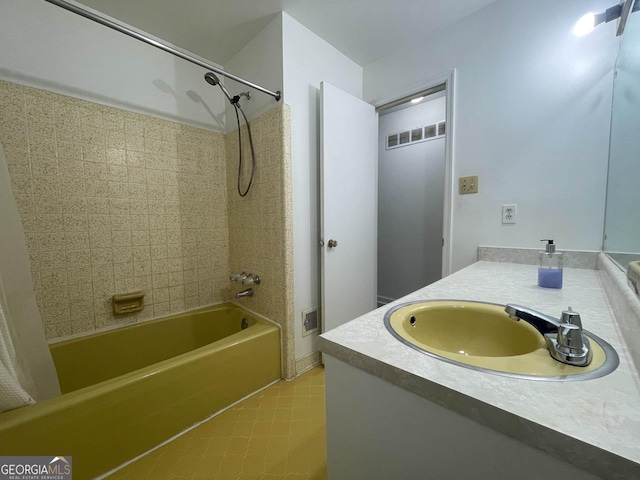 bathroom with vanity and shower / tub combo