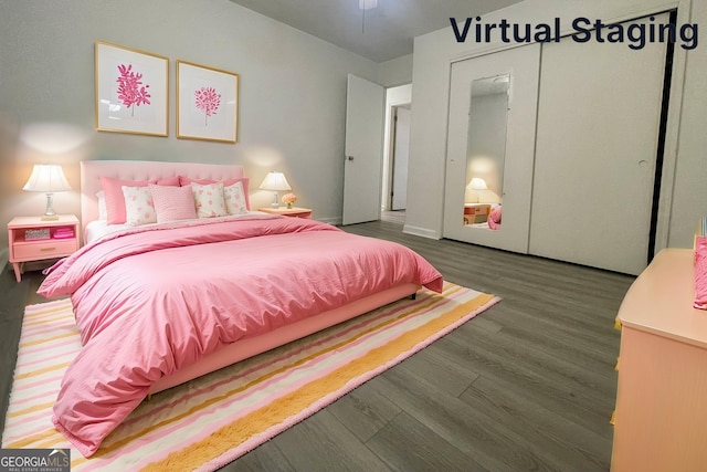 bedroom with a closet and dark hardwood / wood-style floors