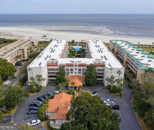 bird's eye view featuring a beach view and a water view