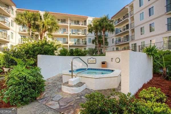 view of swimming pool with a community hot tub