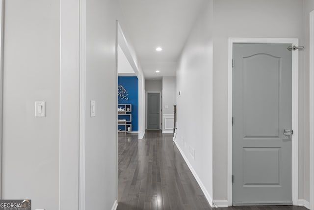 corridor with dark hardwood / wood-style floors