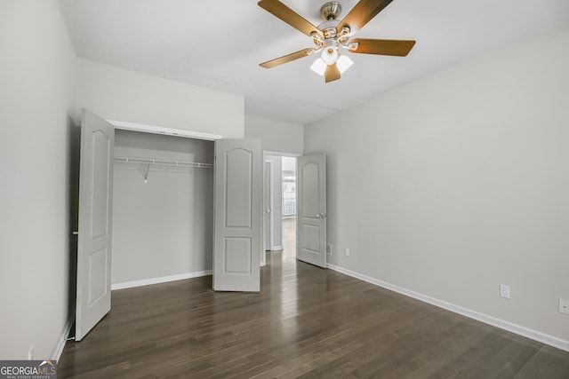 unfurnished bedroom with dark hardwood / wood-style flooring, ceiling fan, and a closet