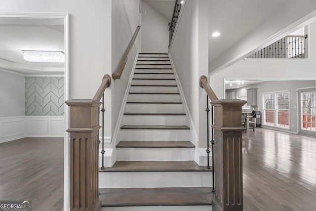 stairs featuring hardwood / wood-style flooring