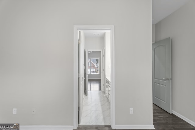 unfurnished room with dark wood-type flooring