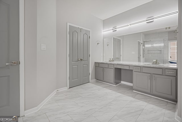 bathroom with vanity and a shower with shower door