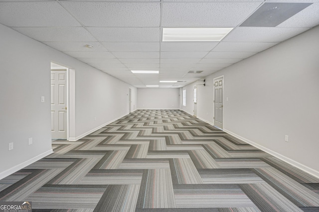 spare room with a paneled ceiling